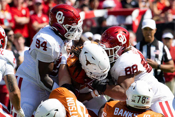 Texas Longhorns running back Jonathon Brooks gets tackled against the Oklahoma Sooners Saturday at the Cotton Bowl.